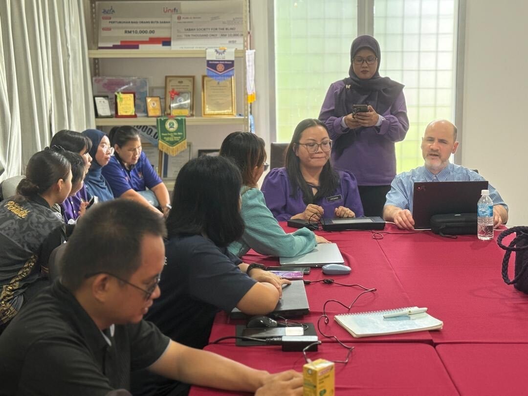 Joe Stephen demonstrating the Dot Pad at the Sabah Society for the Blind